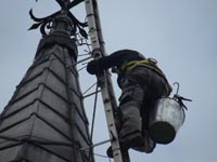 Repairing the weather vane on St James Church